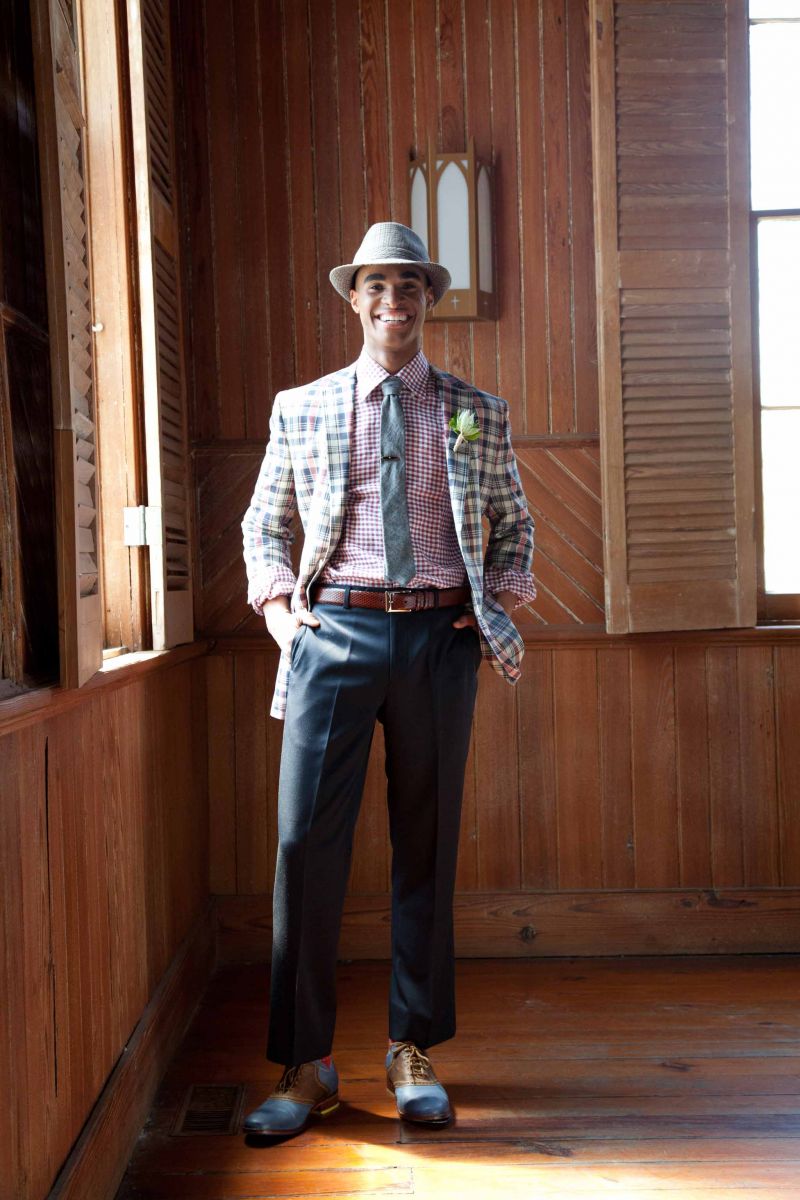 DAPPER DAN: Fitzgerald-fit madras sports coat, navy wool garbadine trousers, and argyle Egyptian cotton  socks, all from Brooks  Brothers. Canali’s plaid oxford, Bill Lavin Soft Collection’s snakeskin belt, and Cole Haan shoes, all from Gwynn’s of Mt. Pleasant. The Hill-side’s tie from Indigo and Cotton. Fedora and vintage tie clip, both from Billy Reid. OMEGA’s Seamaster Aqua Terra watch in 18K rose gold and stainless steel from Kiawah Fine Jewelry.