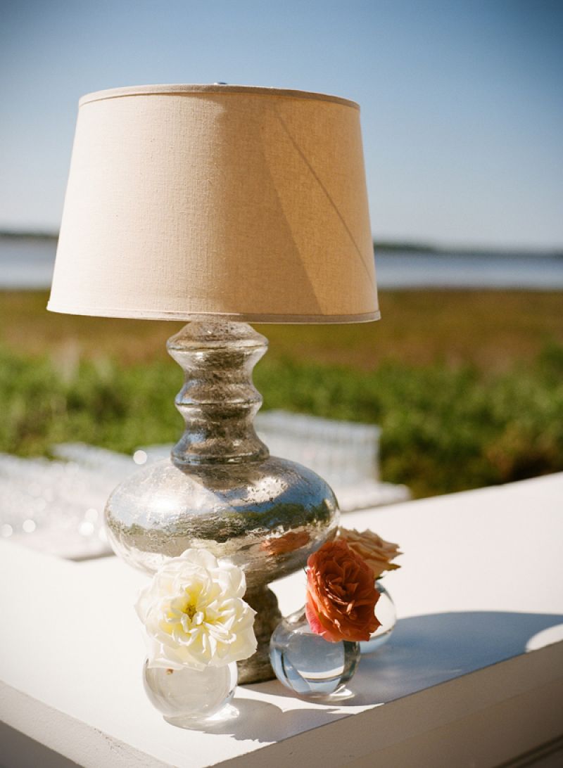 THE GREAT OUTDOORS: Planner Luke Wilson added a homey feel to the open-air bar area with mercury-glass lamps and blooms in vases