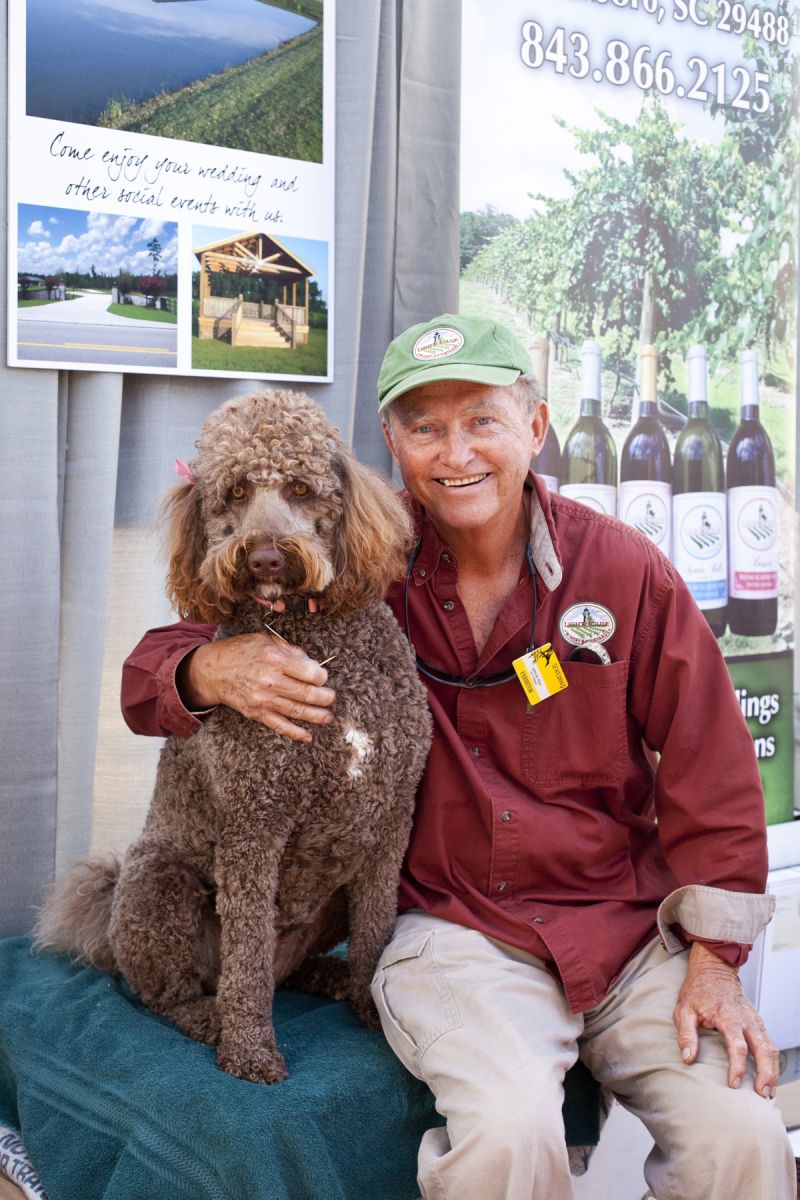 Ralph Messenburg with his Poodle, Dory.