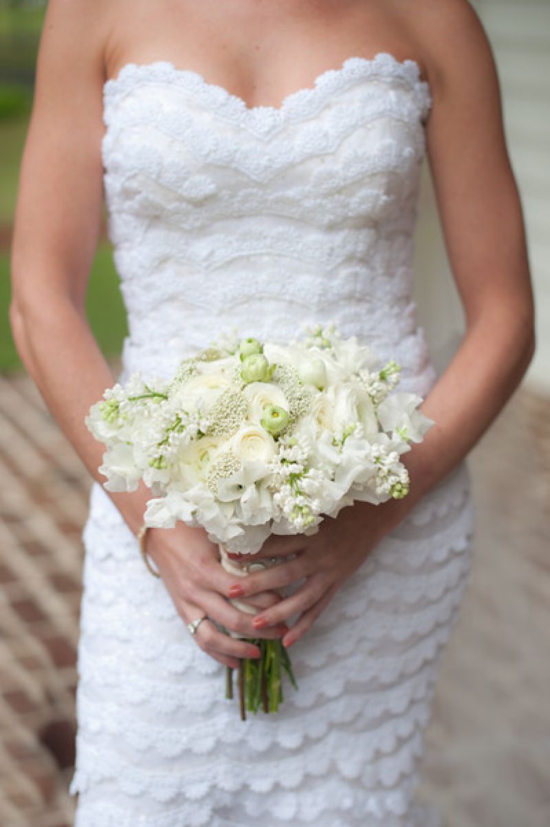 TO HAVE AND TO HOLD: Florist Sue Burton mixed white parrot tulips with Baby’s Breath and other seasonal blooms.