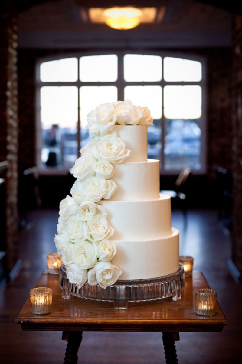 TWO-FACED: The four-tiered cake by The Cake Stand featured one side of smooth white icing, and another of cascading roses.