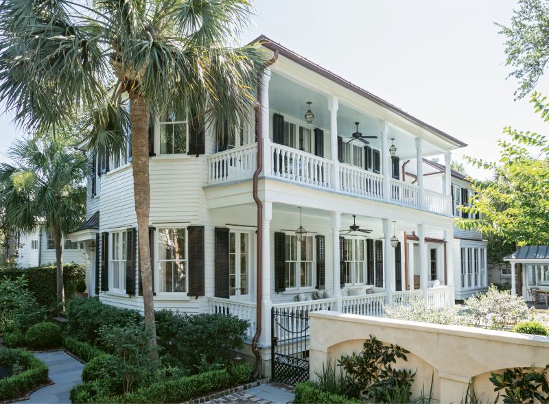HOME AWAY FROM HOME: Picturesque piazzas and palm trees formed the Charleston vacation home ideals of a couple from Omaha looking for a winter retreat. Following an extensive renovation by Beau Clowney Architects and Tupper Builders, the century-old, late-Victorian charmer was ready for its new family.