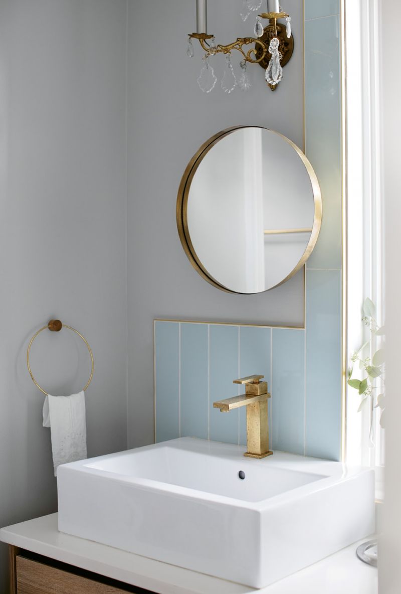 In the master bath, contemporary mirrors from Hausful commingle with antique sconces for a look that’s both vintage and modern.