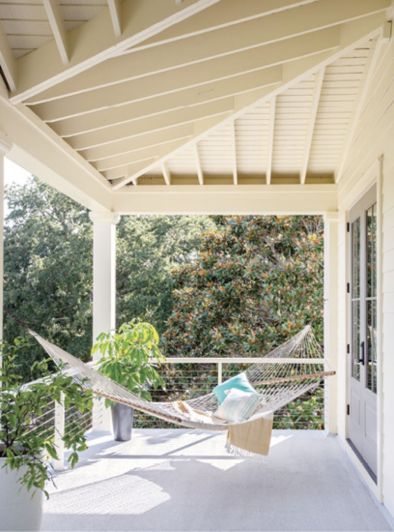 Hang Time: With four porches, there’s always an outdoor perch for sitting and soaking up the sunshine, such as this double hammock, a housewarming gift, off the guest rooms.