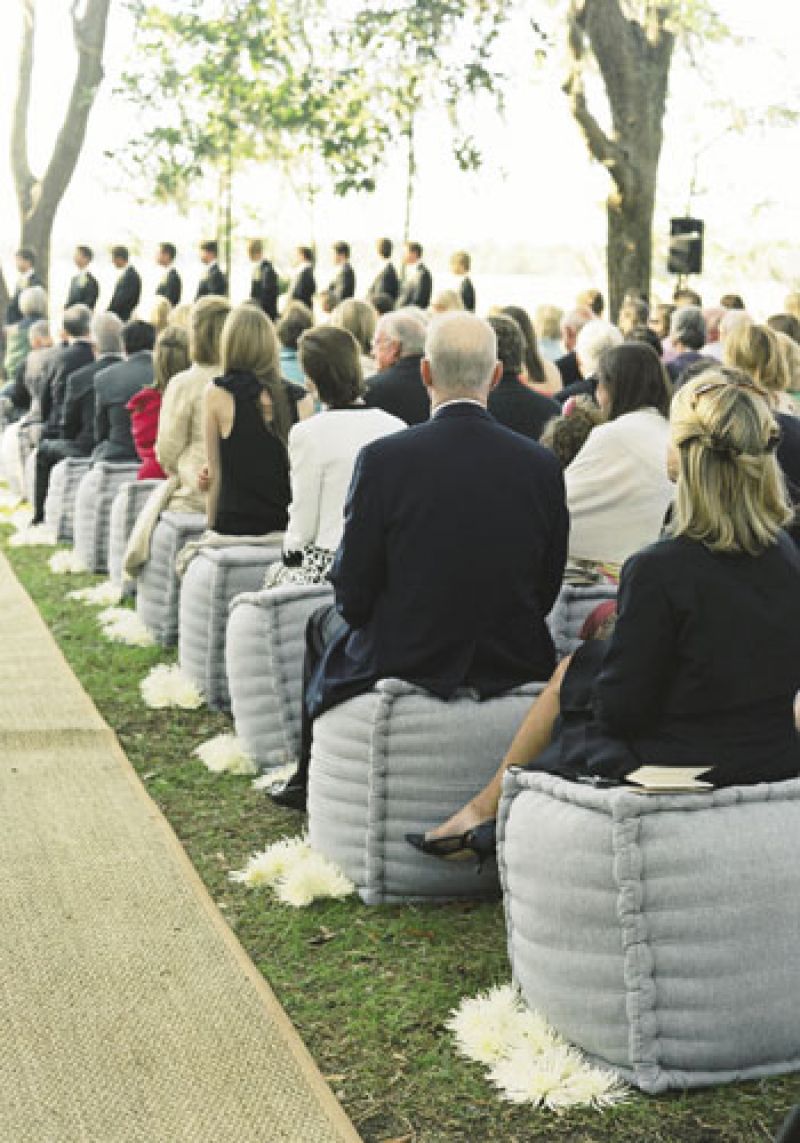 Soft Spot : Guests witnessed the vows from linen ottomans.