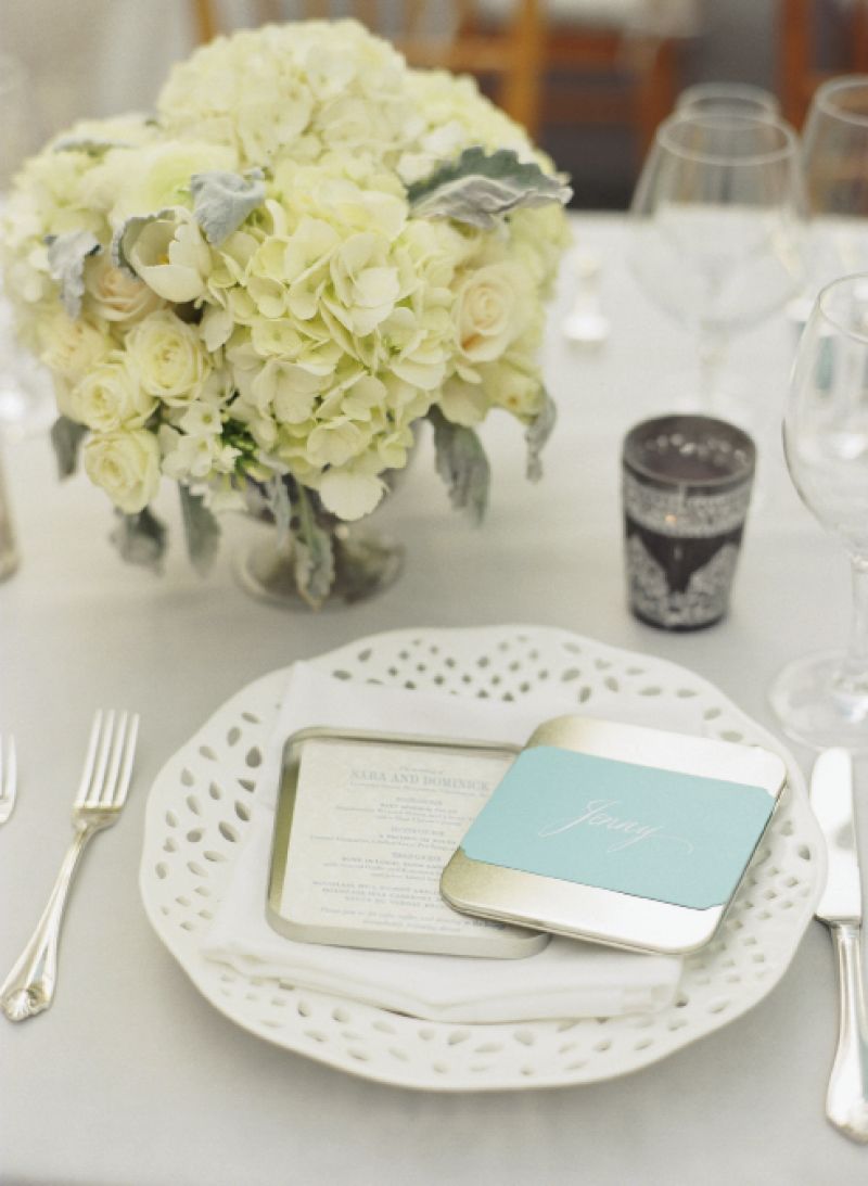 BAND TOGETHER: The Lettered Olive printed dinner menus on paper bearing a soft gray and white design. Blue bands with names calligraphed by Elizabeth Porcher Jones doubled as place cards.