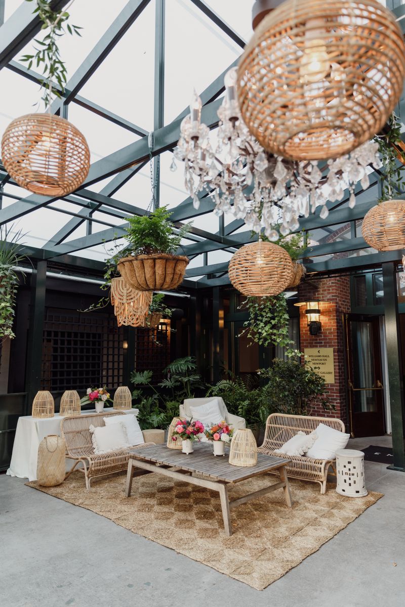 Event designer Tara Guérard decorated Emeline’s greenhouse with hanging greenery and rattan lanterns.