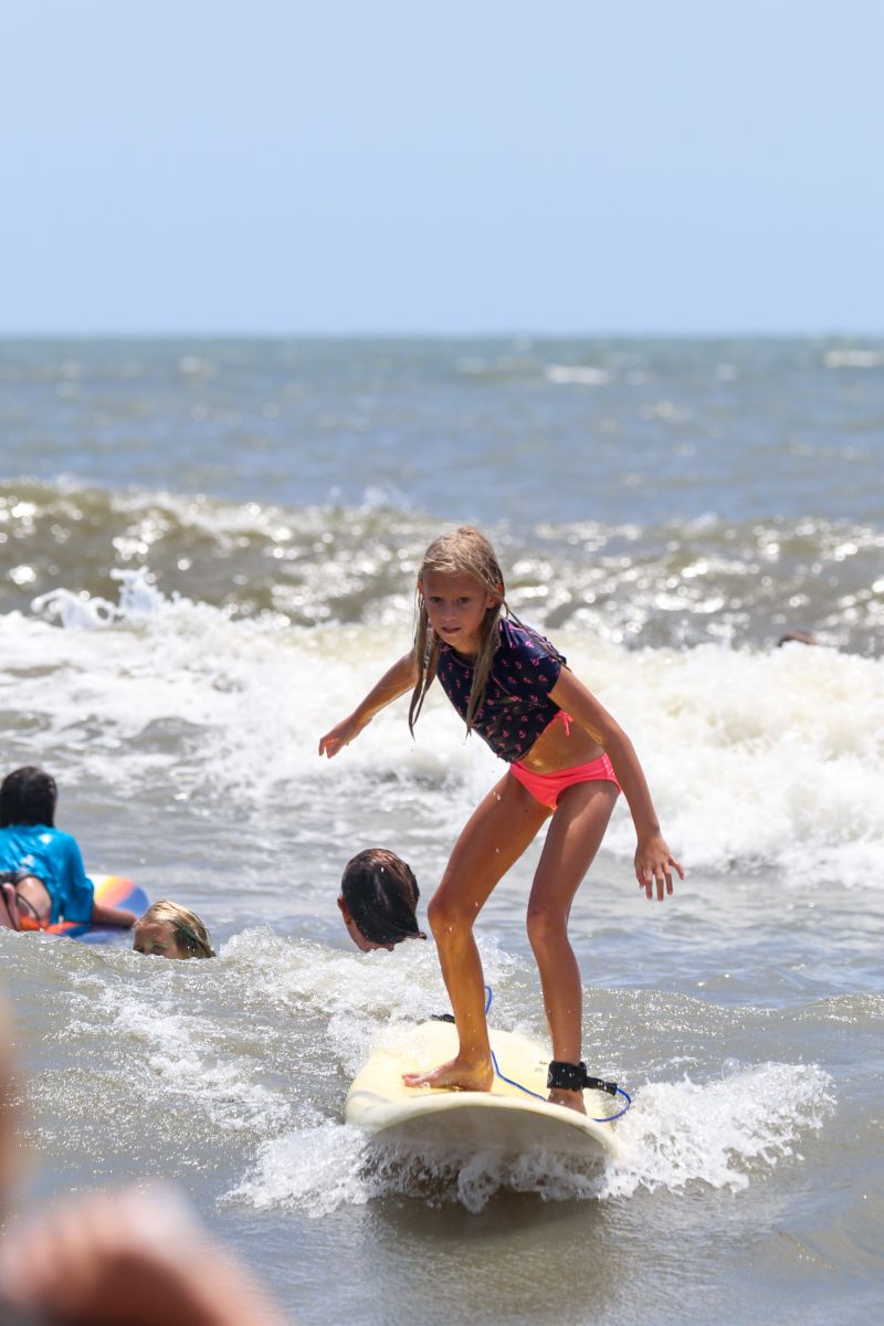 A young competitor takes to the waves.