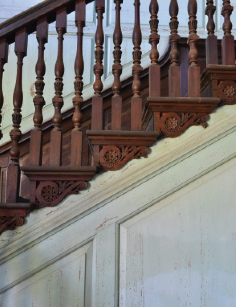 The wood carving and wainscoting of Drayton Hall’s dramatic staircase were once painted a brilliant vermilion hue.
