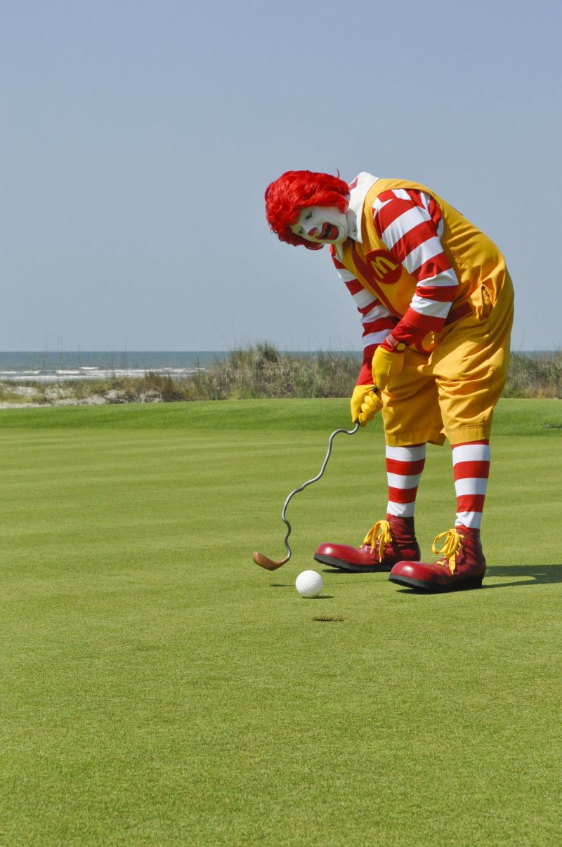 Ronald McDonald warmed up for the tournament with some easy putts. He might need a new club!
