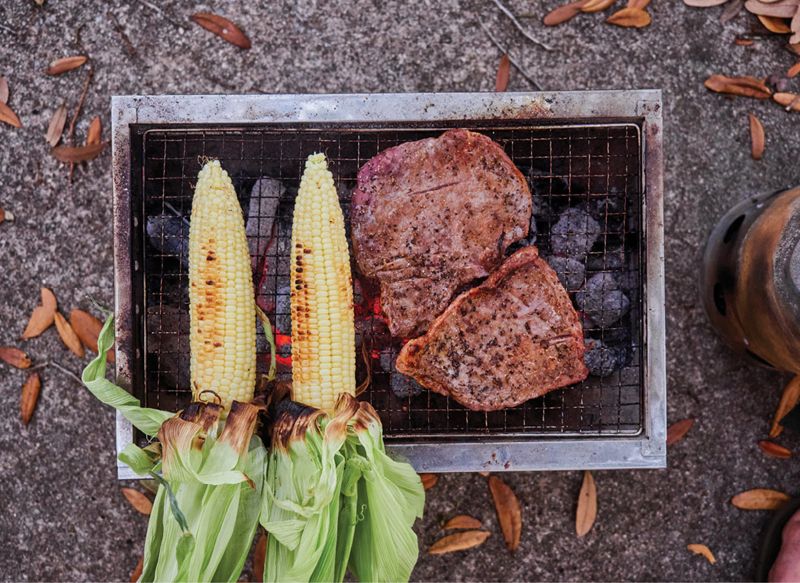 Fresh corn and steaks on the grill.