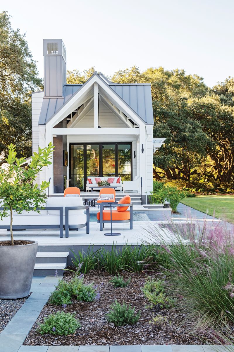 Adjacent to the pool, the guest house includes a living room, accented by an art wall featuring pieces from Atrium Art Gallery, where visiting friends and family can lounge on the Arhaus sectional and take in the view.