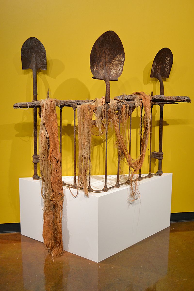 The opening artwork to Holley&#039;s exhibit, &quot;Three Shovels to Bury You&quot;