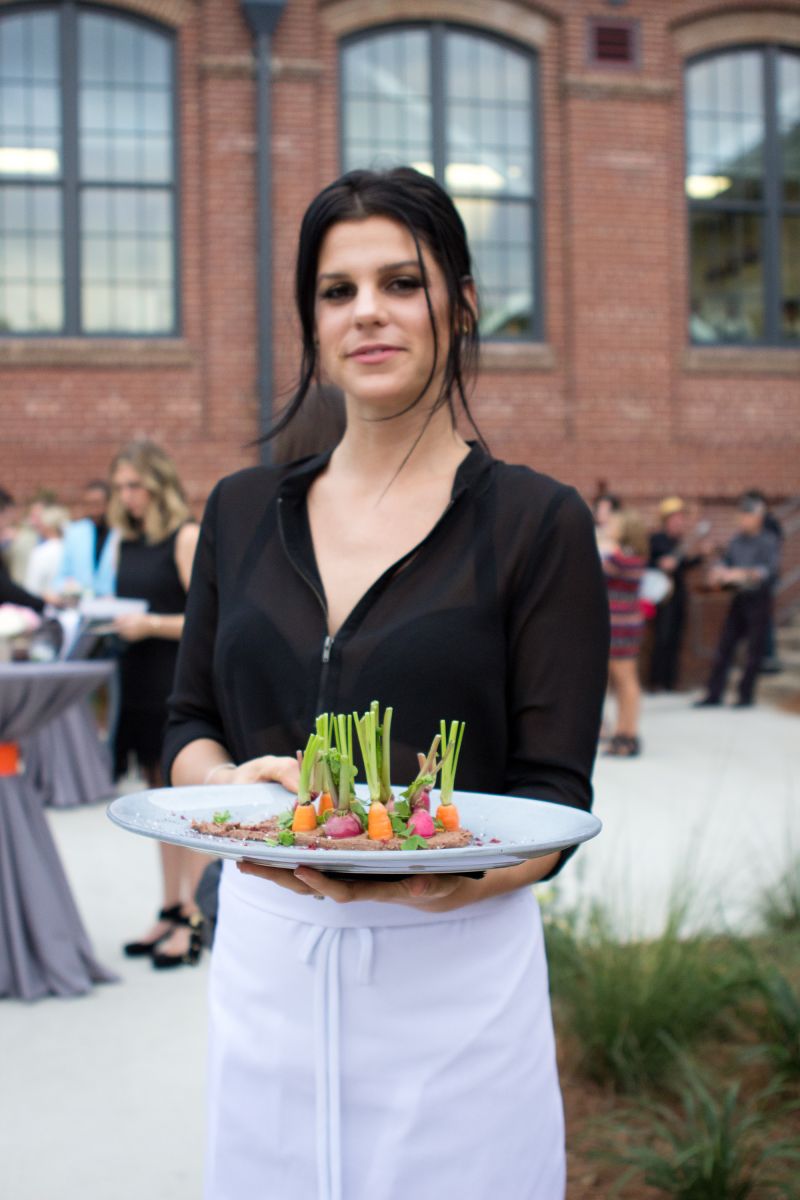 Carly Painter served red pea hummus with organic radishes and carrots before the dinner.