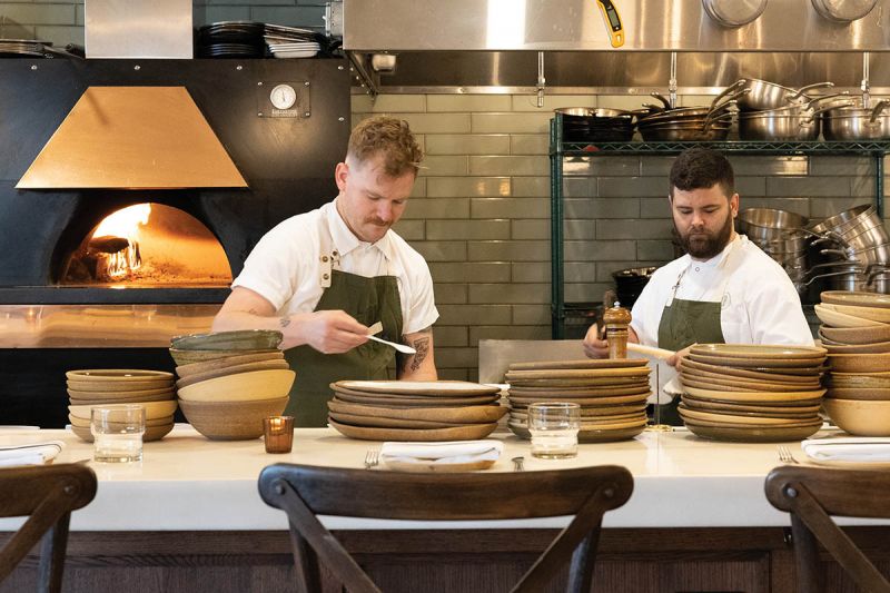 Chef-owner Mark Bolchoz (left) and chef de cuisine Alex Fagan in the open kitchen