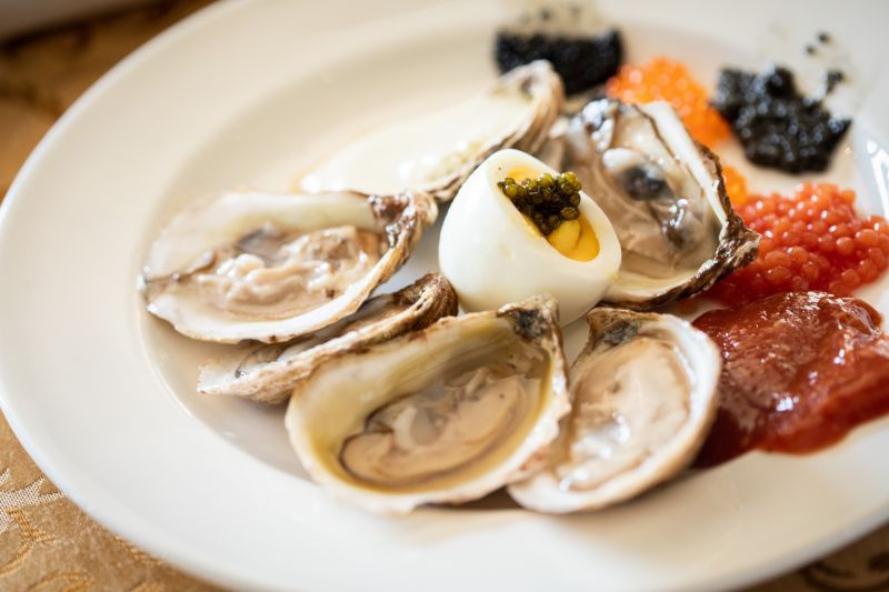 Wood-fired oysters on the half shell prepared by Kiawah Island  Golf Resort chef Jeff Cali.