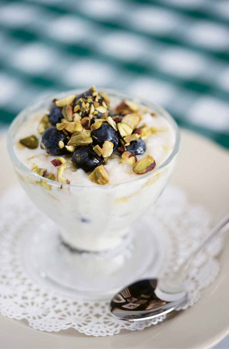 Old-School Charm: Rice pudding with fresh fruit and nuts hints at earlier decades.
