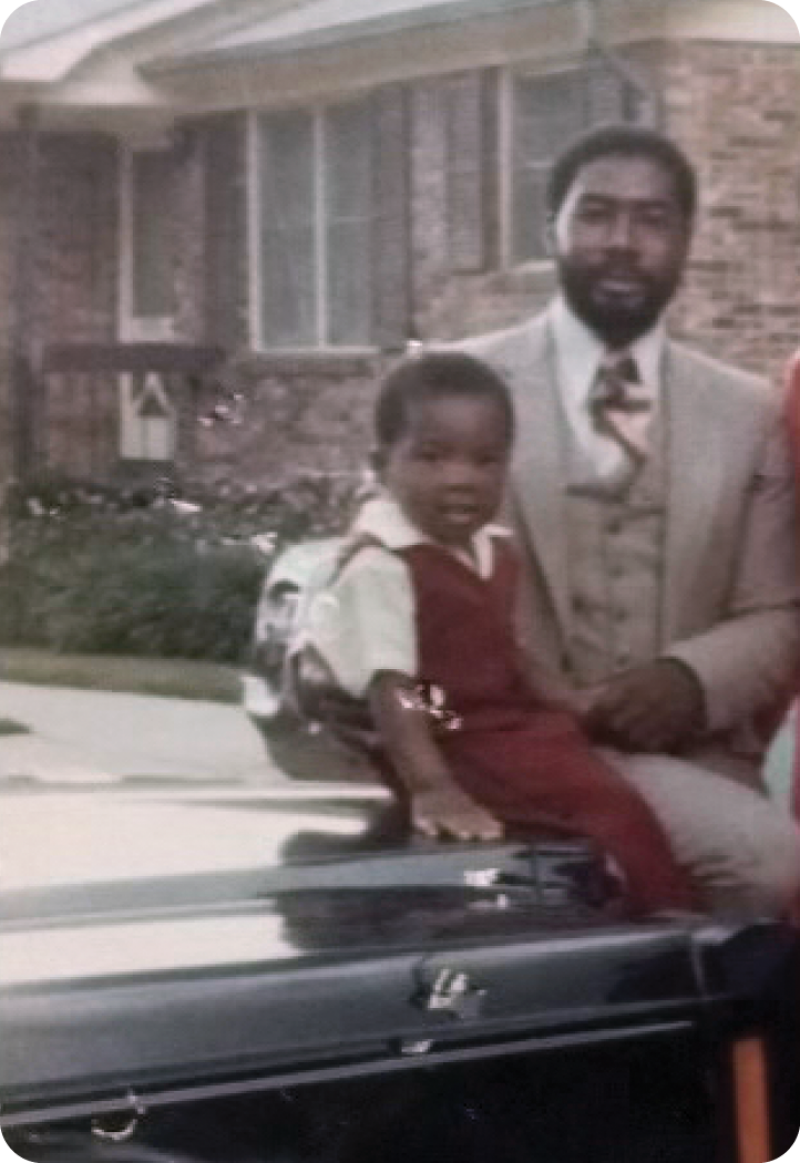 A young Lenard with his father, Larry.