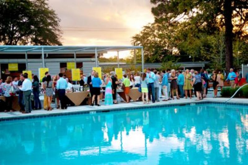 Guests mingled on the pool deck of the Mixson Bath and Racquet Club