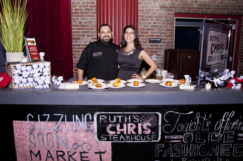 Ruth&#039;s Chris Steakhouse&#039;s Sabrina Delio and Jonathan I. M. Kaldas created a bourbon braised pork belly orange &quot;corn dog&quot; with infused smoke cherry glaze.