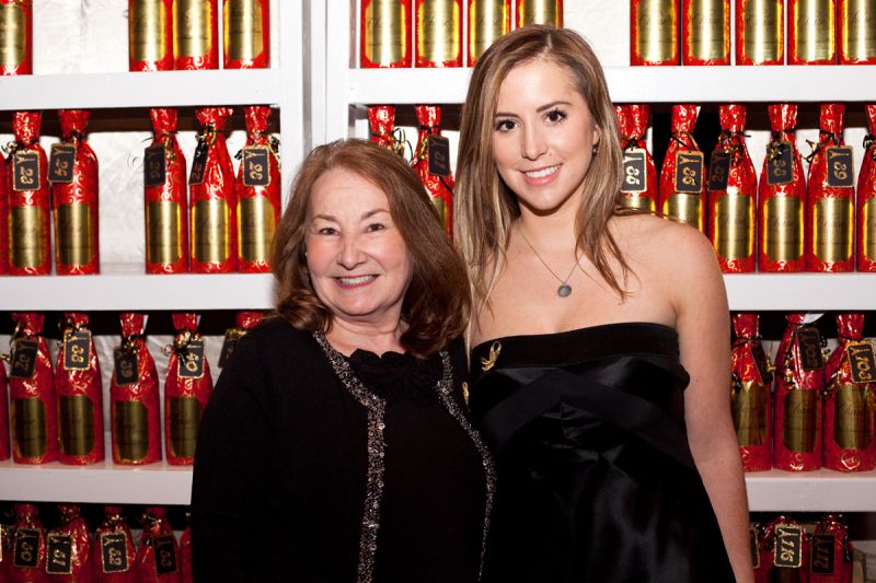 Kate Smith and Nancy Miner in front of the &quot;Wall of Wine.&quot;