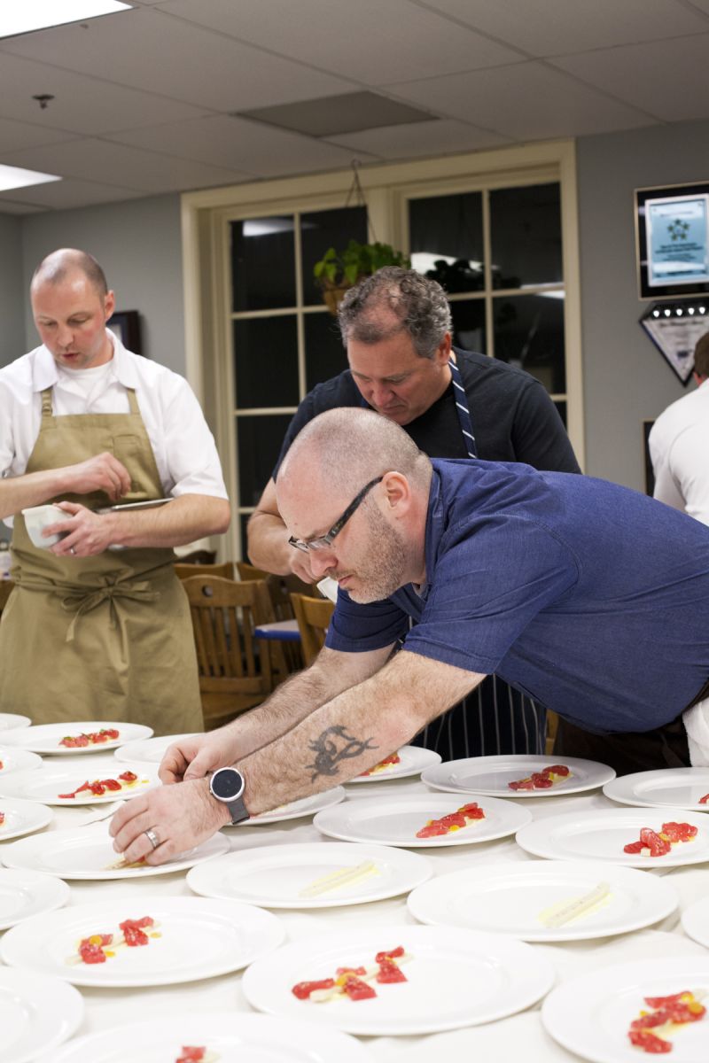 The guest chefs worked together with the Ocean Room staff plating up the first course.