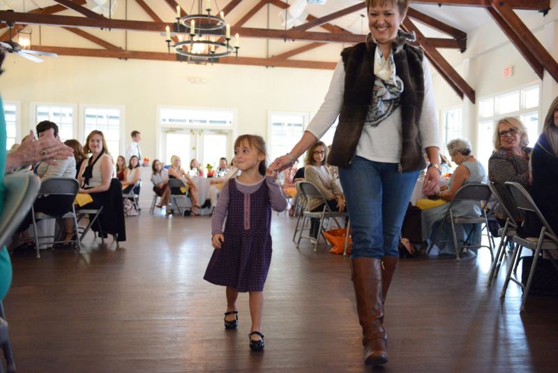 Four-year-old McKenzie Evans took to the runway with her mother, Elizabeth Turner.