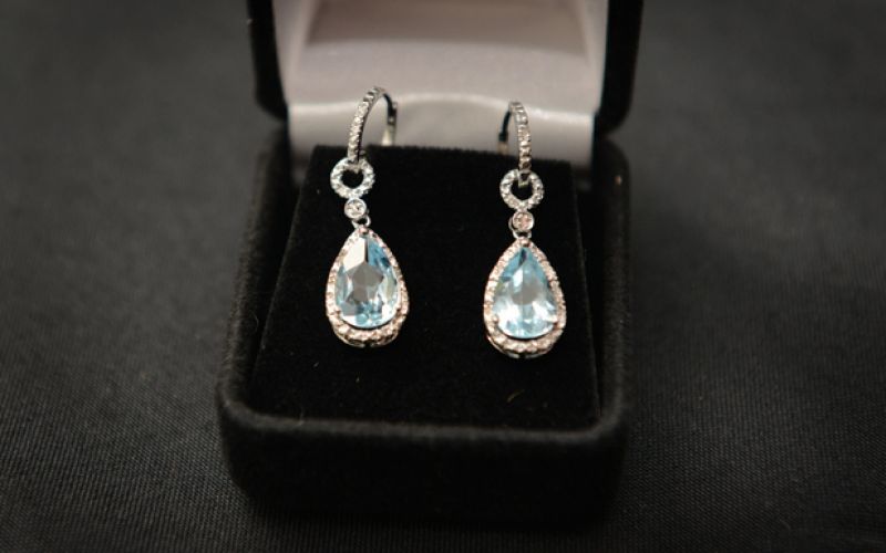 Party-goers could bid on these blue topaz earrings.