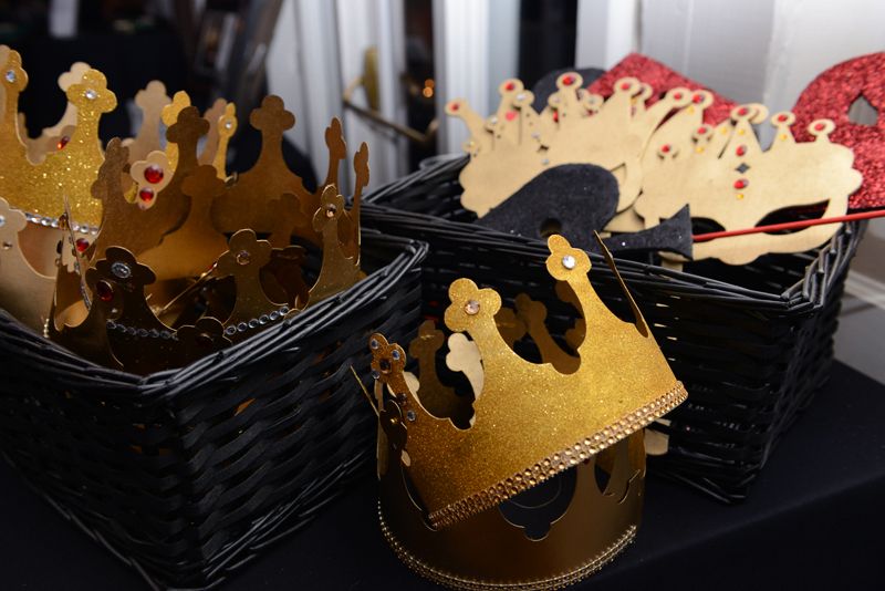 Masks and crowns were provided as props in the photo booth.