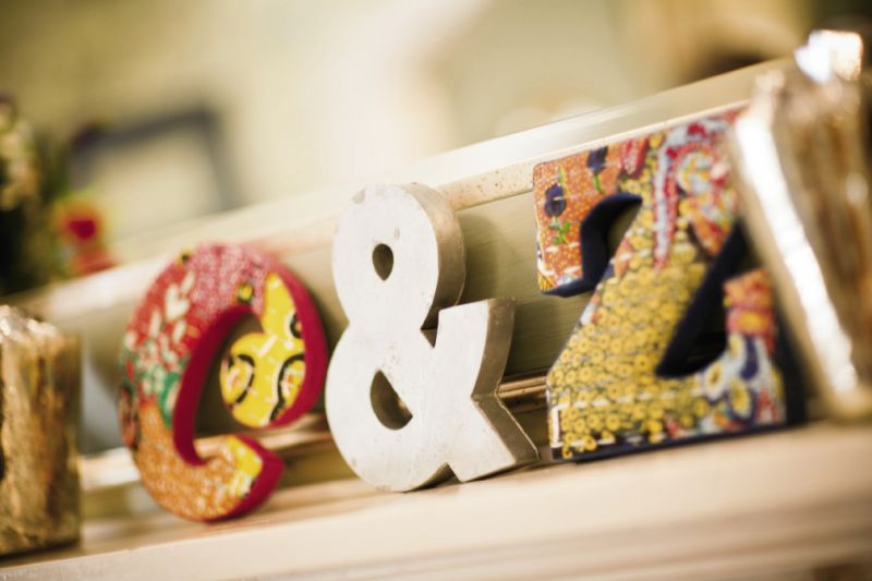 EASY AS ABC: Fabric-covered letters (“C &amp; Z”) from Anthropologie added to the mishmash of colors and prints.