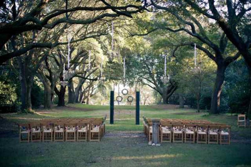OPEN-DOOR POLICY: The backdrop for the ceremony—a 10-foot historic iron gate and two old green shutters—was custom-made by the bride’s uncle, Ron Rader of Antebellum Restoration in Prosperity, South Carolina.