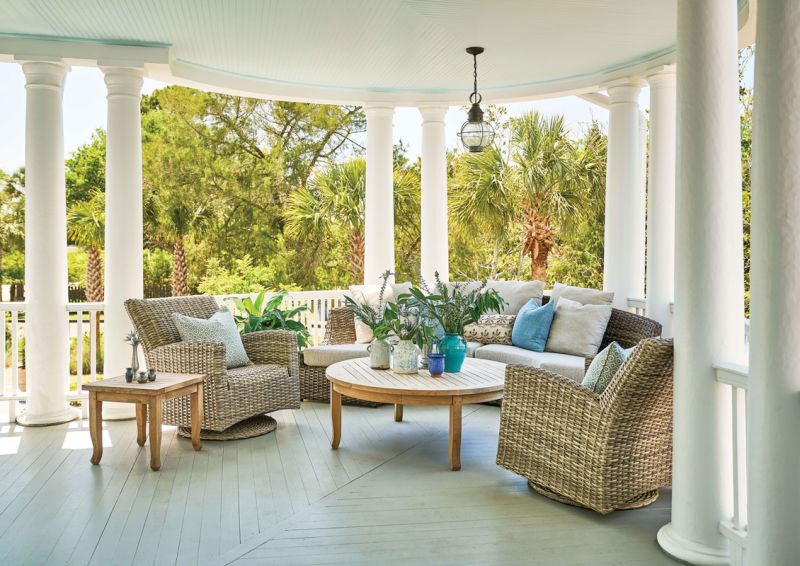 One of the couple’s favorite spots is the front porch, where swivel chairs and teak tables from Outside Is In and a curved sectional from GDC provide plenty of space to soak up the sea breezes.