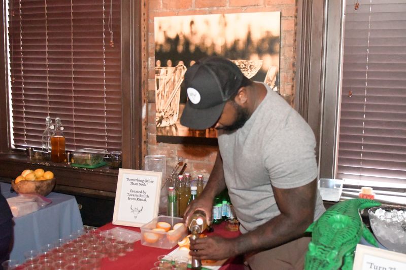A guest pours a “Something Other Than Soda” by Tavaris Smith of Ritual Restaurant &amp; Lounge.