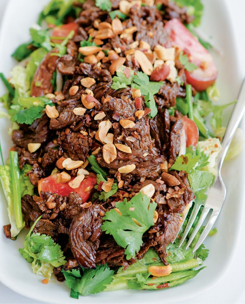 Cook’s wok-seared garlic steak with Thai salad
