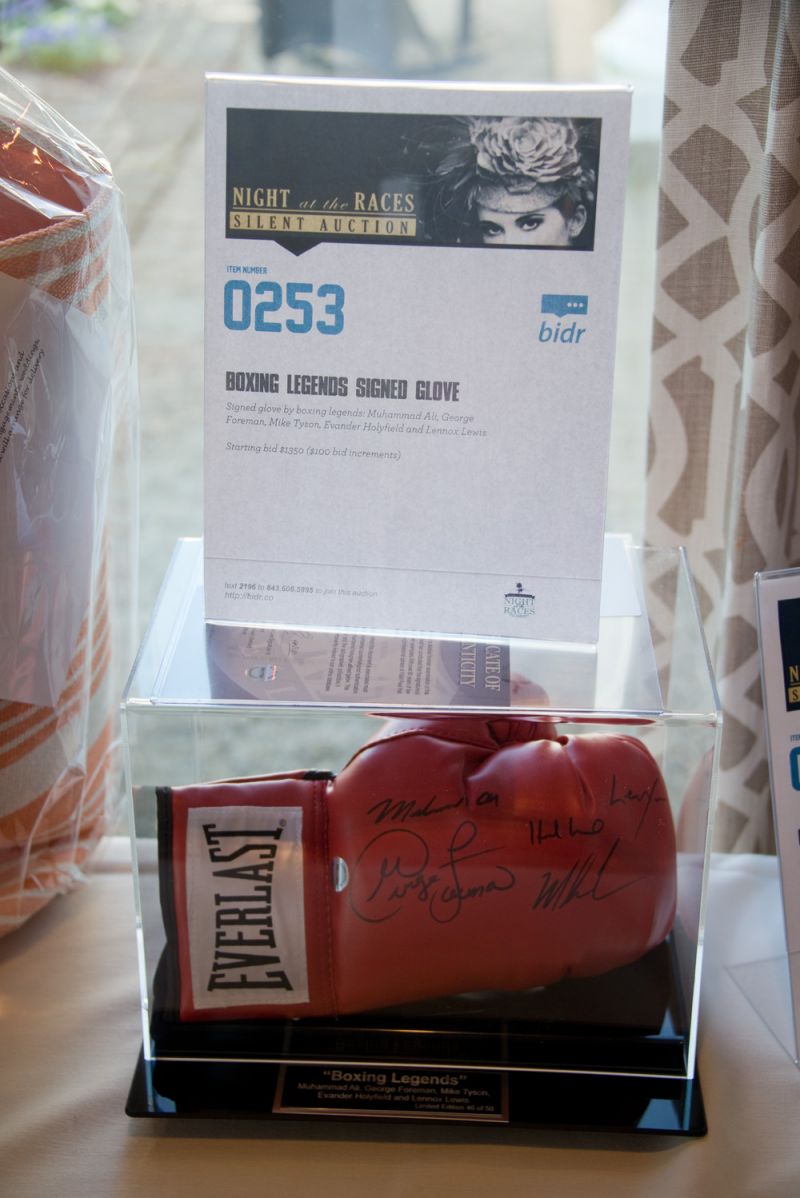 Boxing glove signed by legends Muhammad Ali, George Foreman, Mike Tyson, Evander Holyfield and Lennox Lewis