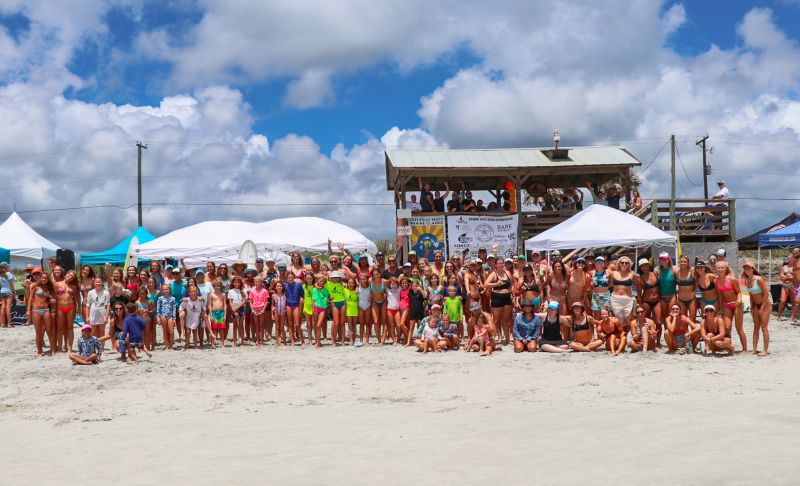 Surfers gather for a group photo during the 2023 Folly Beach Wahine Classic.