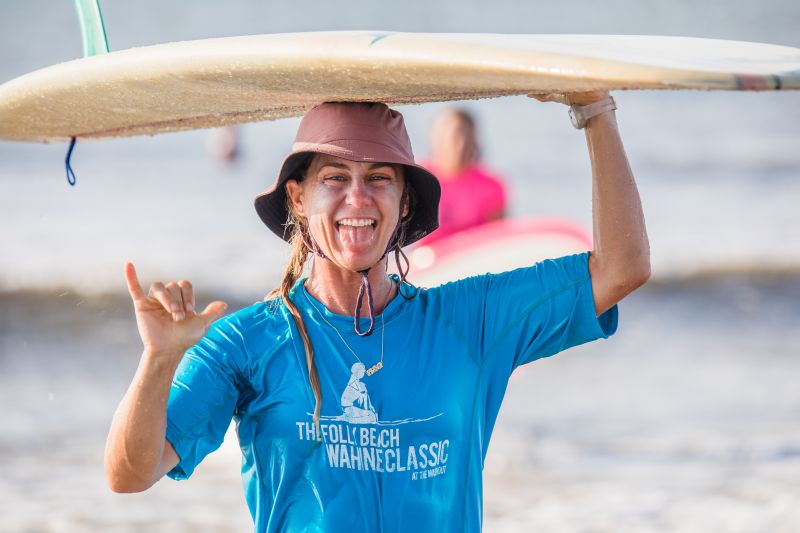 Surfer girl Kate Barattini flashes a grin during the Folly Beach Wahine Classic.