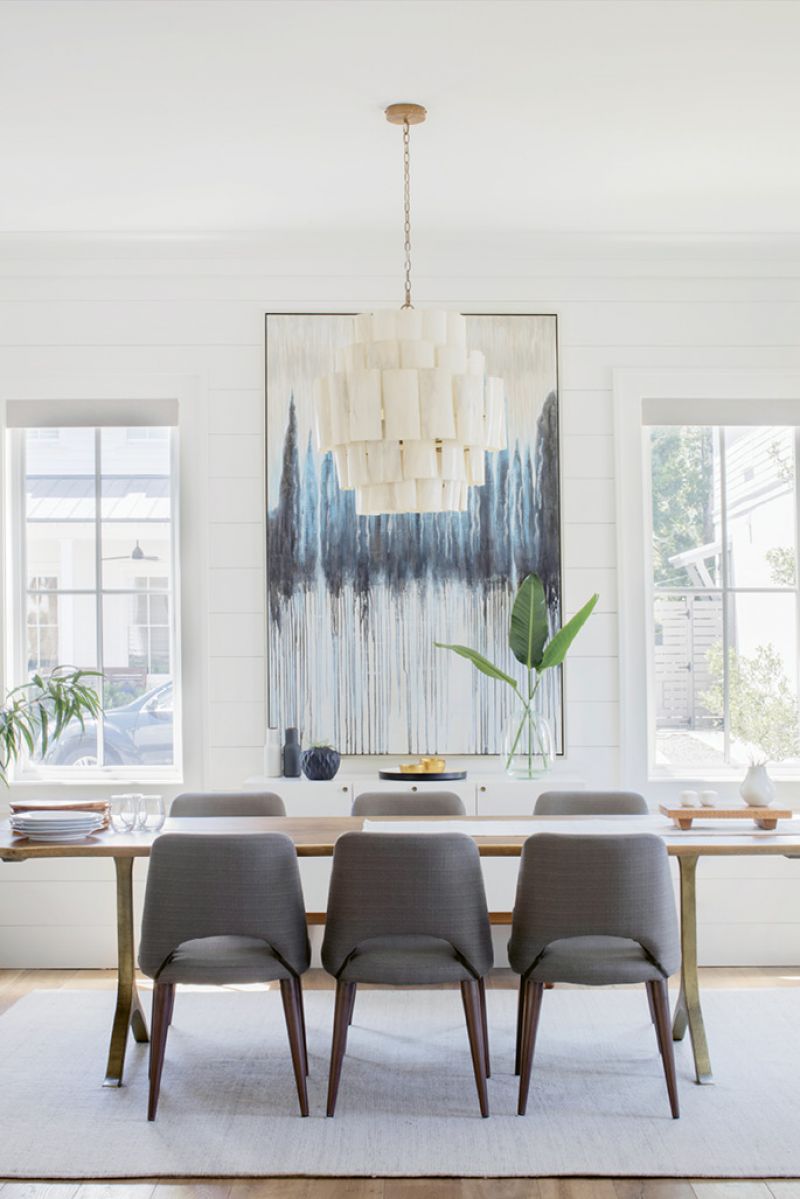 Sit a Spell: Most mornings—post-school-drop-off—find Tracie in the light-filled dining room reviewing images and reading magazines. The oak table is from Anthropologie, and the resin-covered banana-bark chandelier from Candelabra.