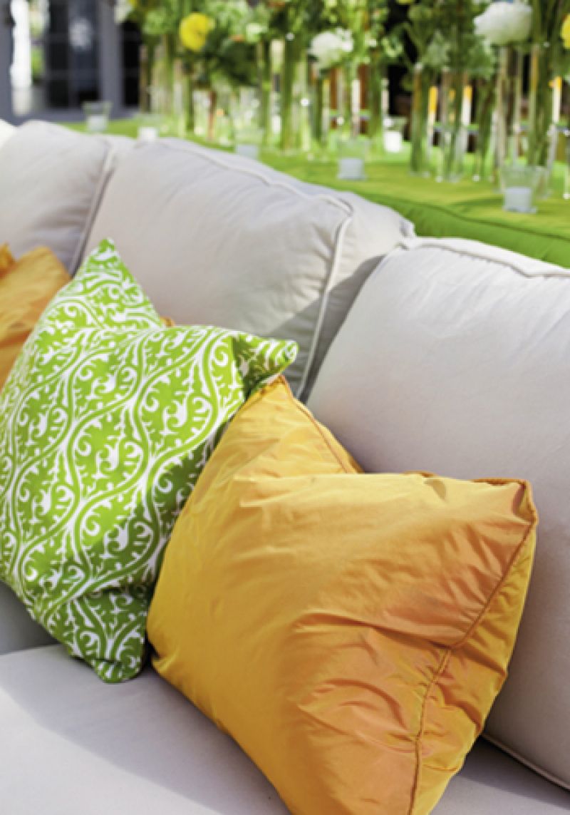 SPRING THING: Custom pillows added comfy pops of color to the setting.