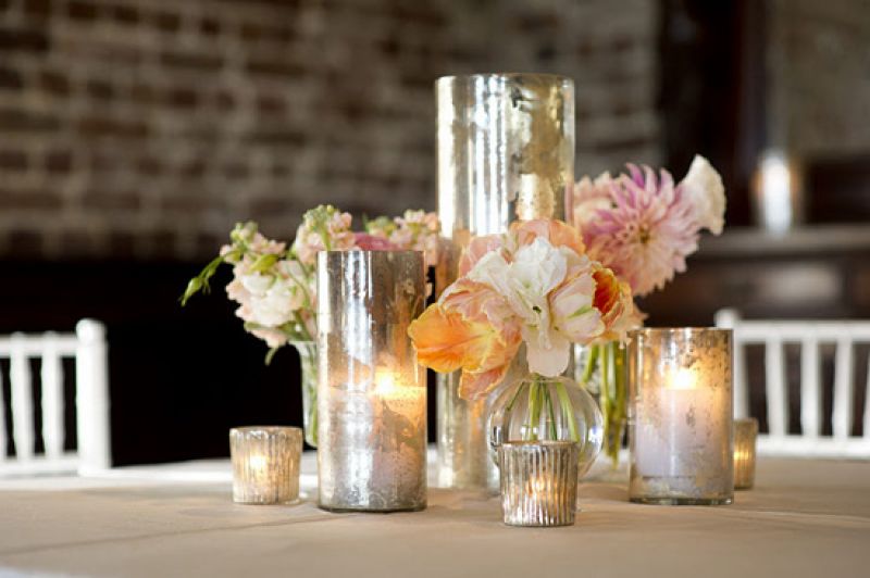 LET THERE BE LIGHT: Mercury glass vases added sheen, sparkle, and depth to the setting.