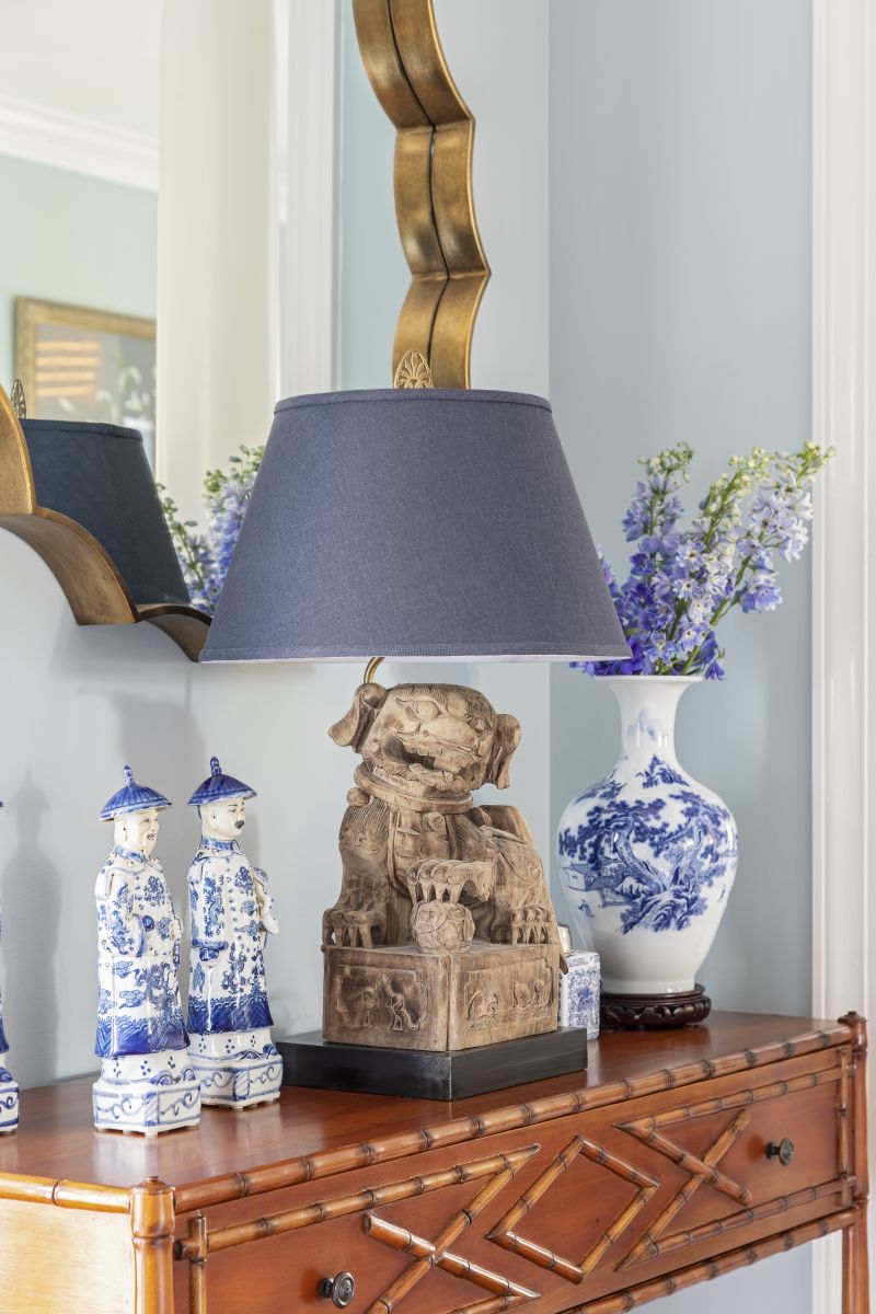A carved mahogany console table from Bebe &amp; Lenox showcases Peggy’s collection of blue and white porcelain.