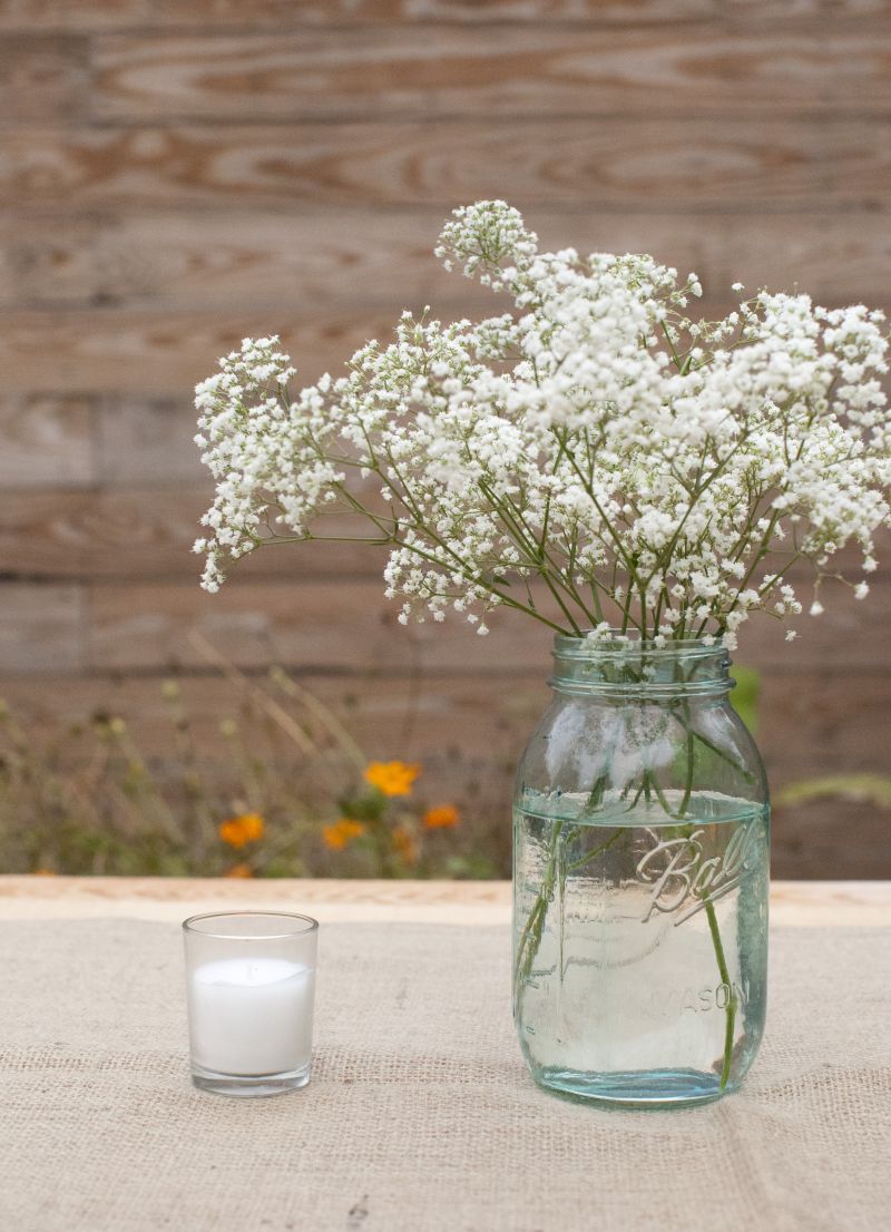 BARELY THERE: Flower arrangements were artfully spare, like baby’s breath in a Ball jar.