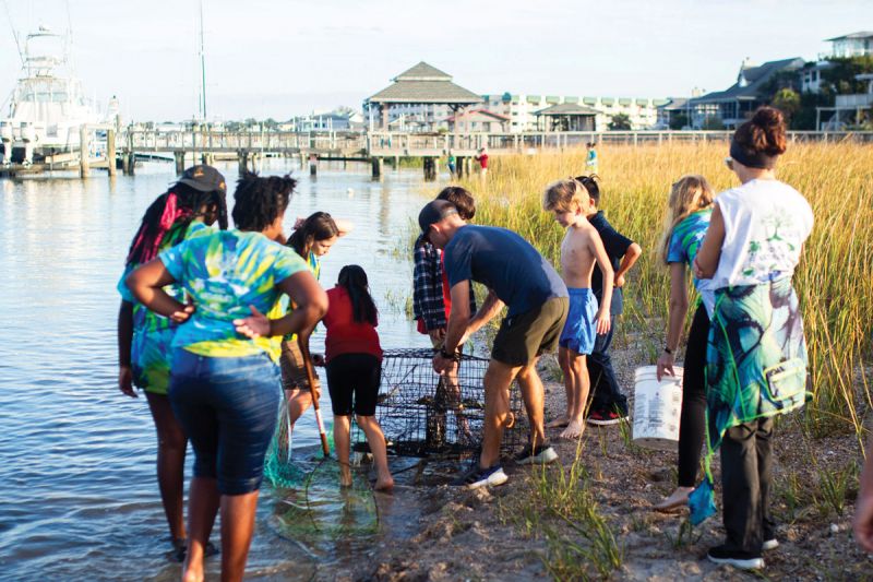 The Young Naturalists program teaches fourth-through-eighth-grade students about environmental stewardship through hands-on activities, such as crabbing...