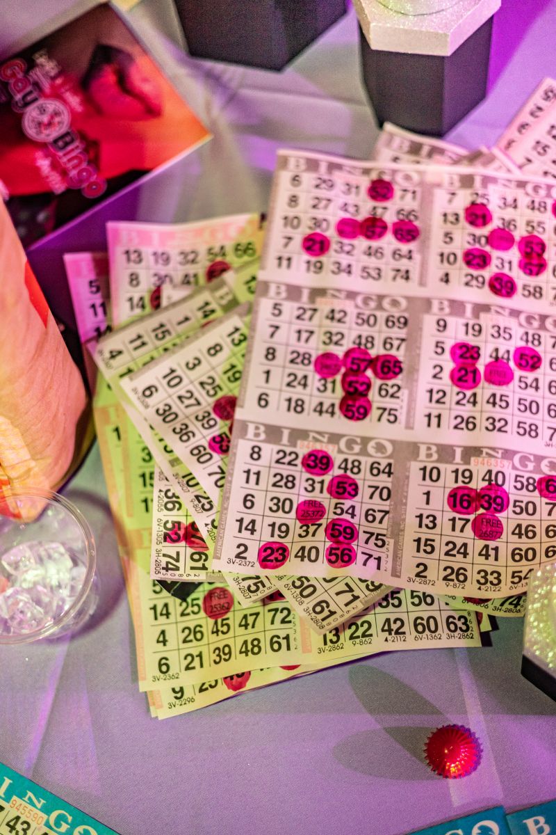 Guests used red daubers to mark their bingo boards, competing for prizes.