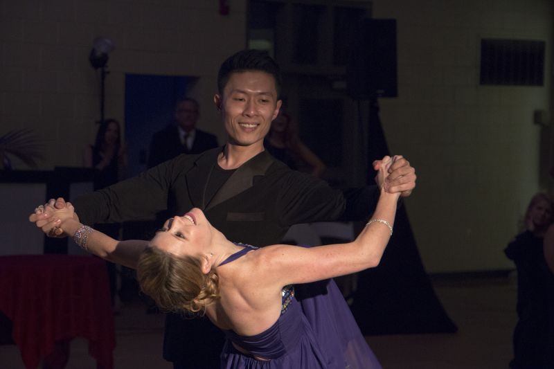 Greer Reagin of Reagin Orthodontics and James Jiang dance the waltz.