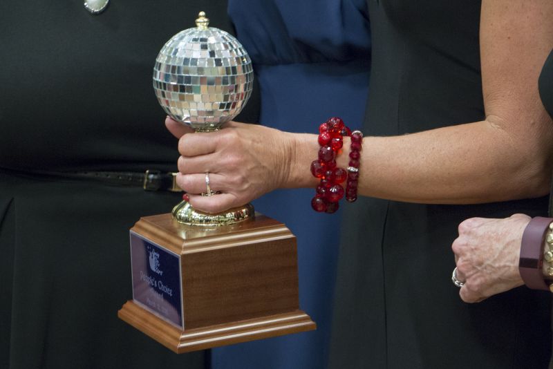 Nancy Deitch clutches the winning mirror ball.