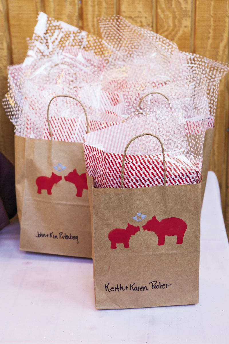 PIG IN A POKE: Gift bags for the barbecue guests were hand stamped with a smooching pair of pigs.