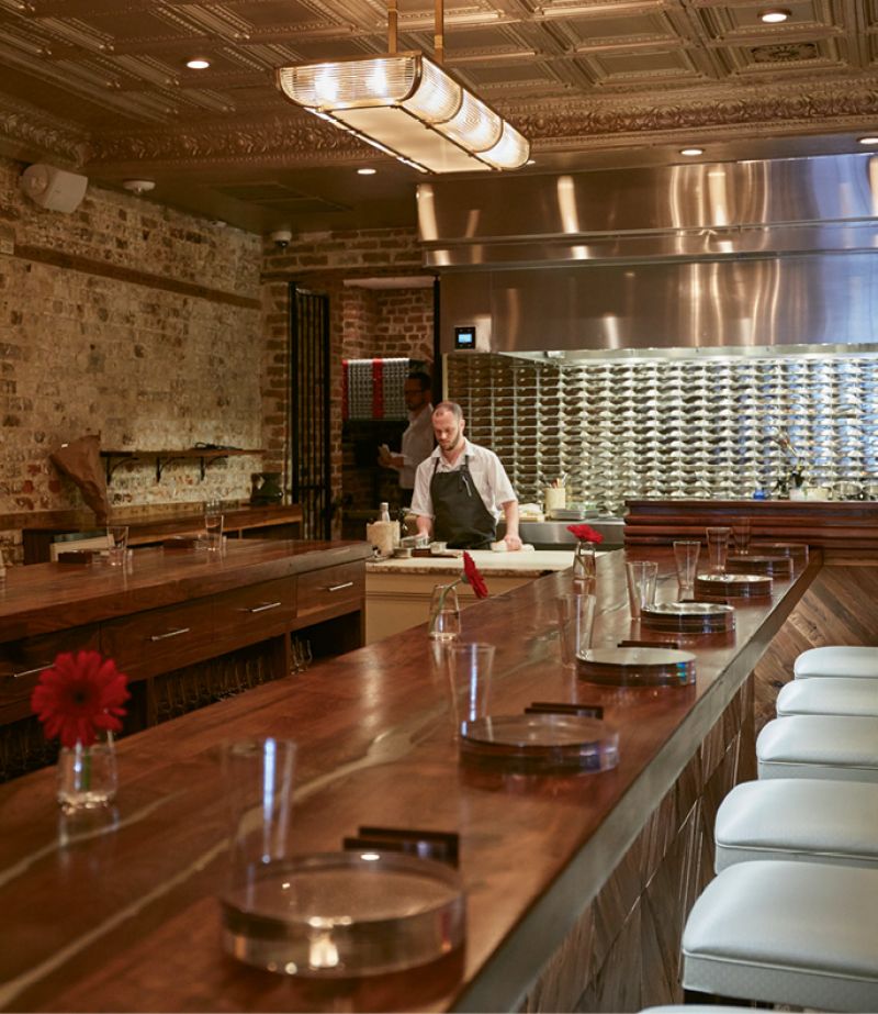 Front-Row Seat: The U-shaped counter provides guests with up-close views of the dinner prep and presentation.