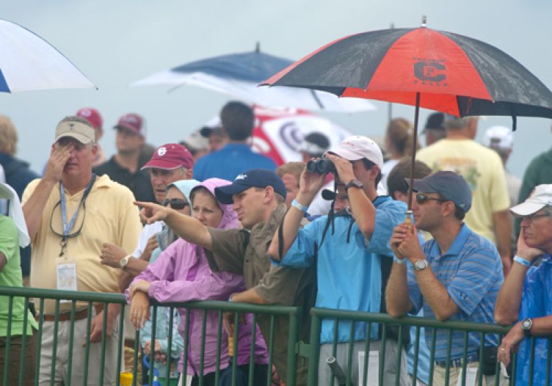 Fans sticking it out in the rain.