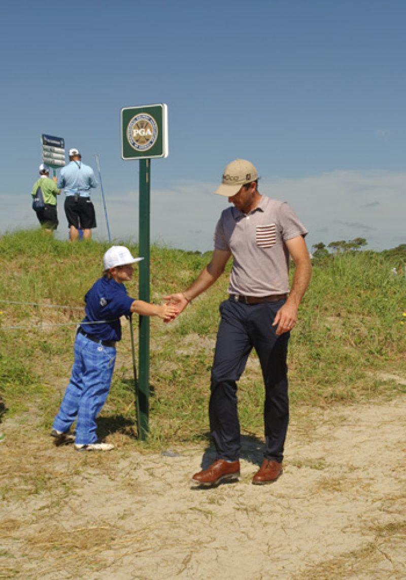 Jeff Ogilvy getting encouragement from a young fan.
